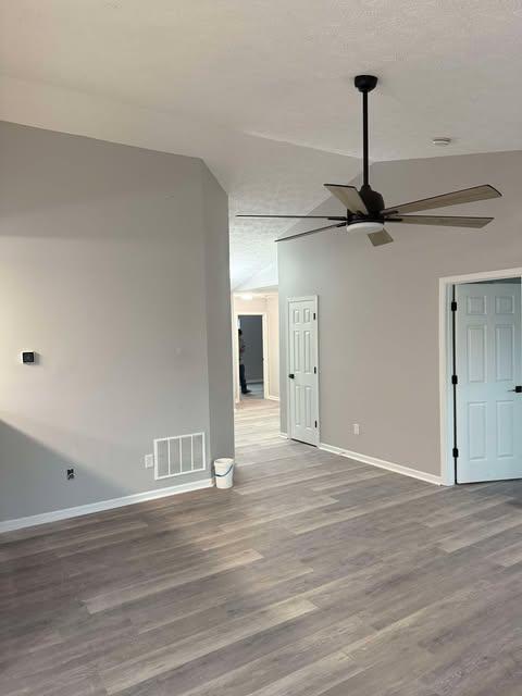 Living room with new flooring and ceiling fan