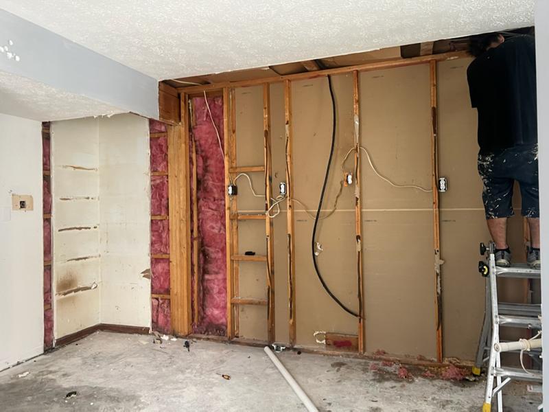 Wall opened to the studs with damaged materials removed