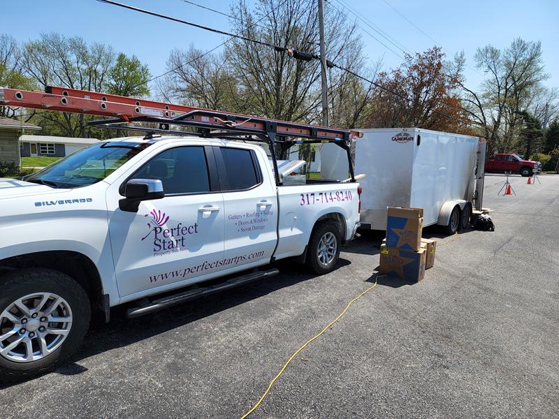 Perfect Start truck and trailer parked at a job site