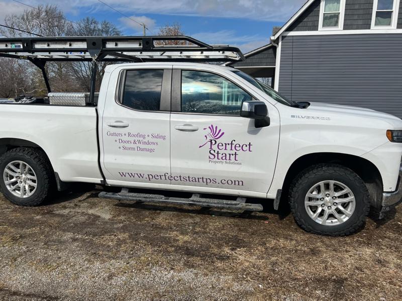 Perfect Start pickup truck with the company logo on the door